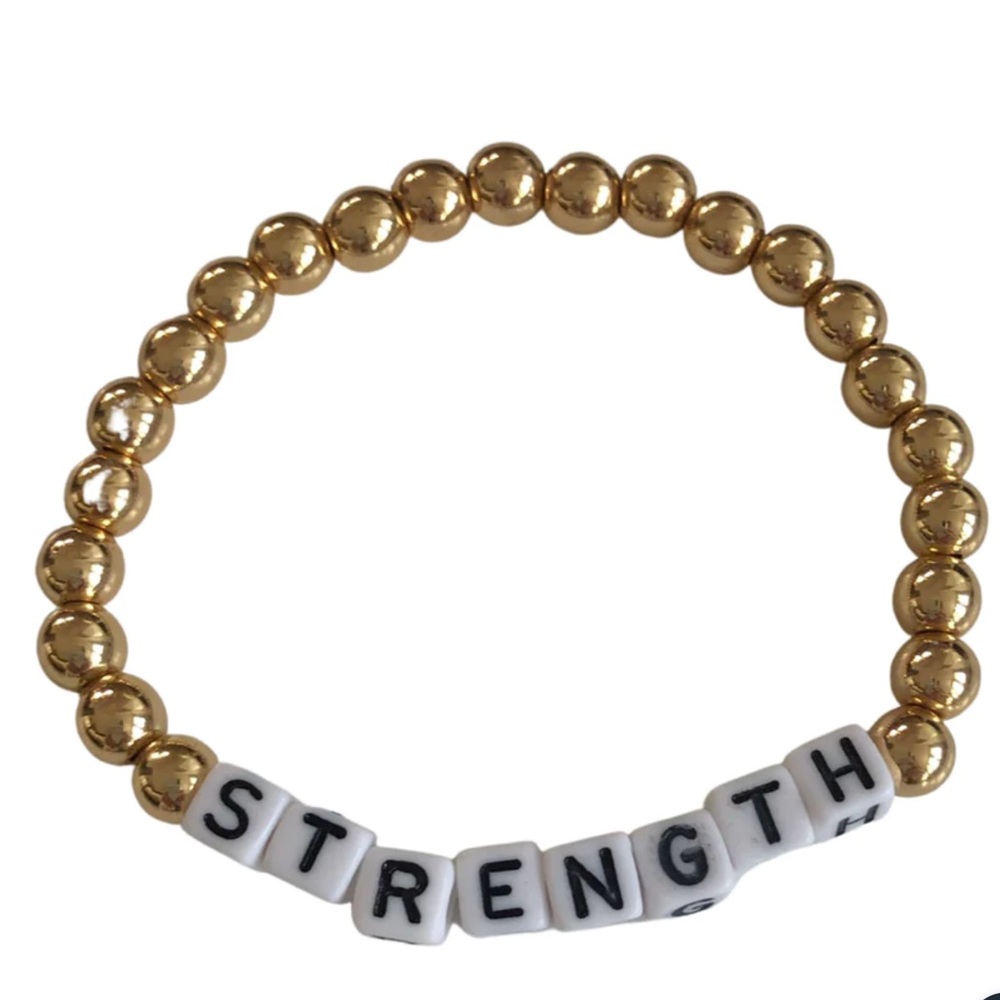 Shop STRENGTH Gold Hematite Beaded Bracelet